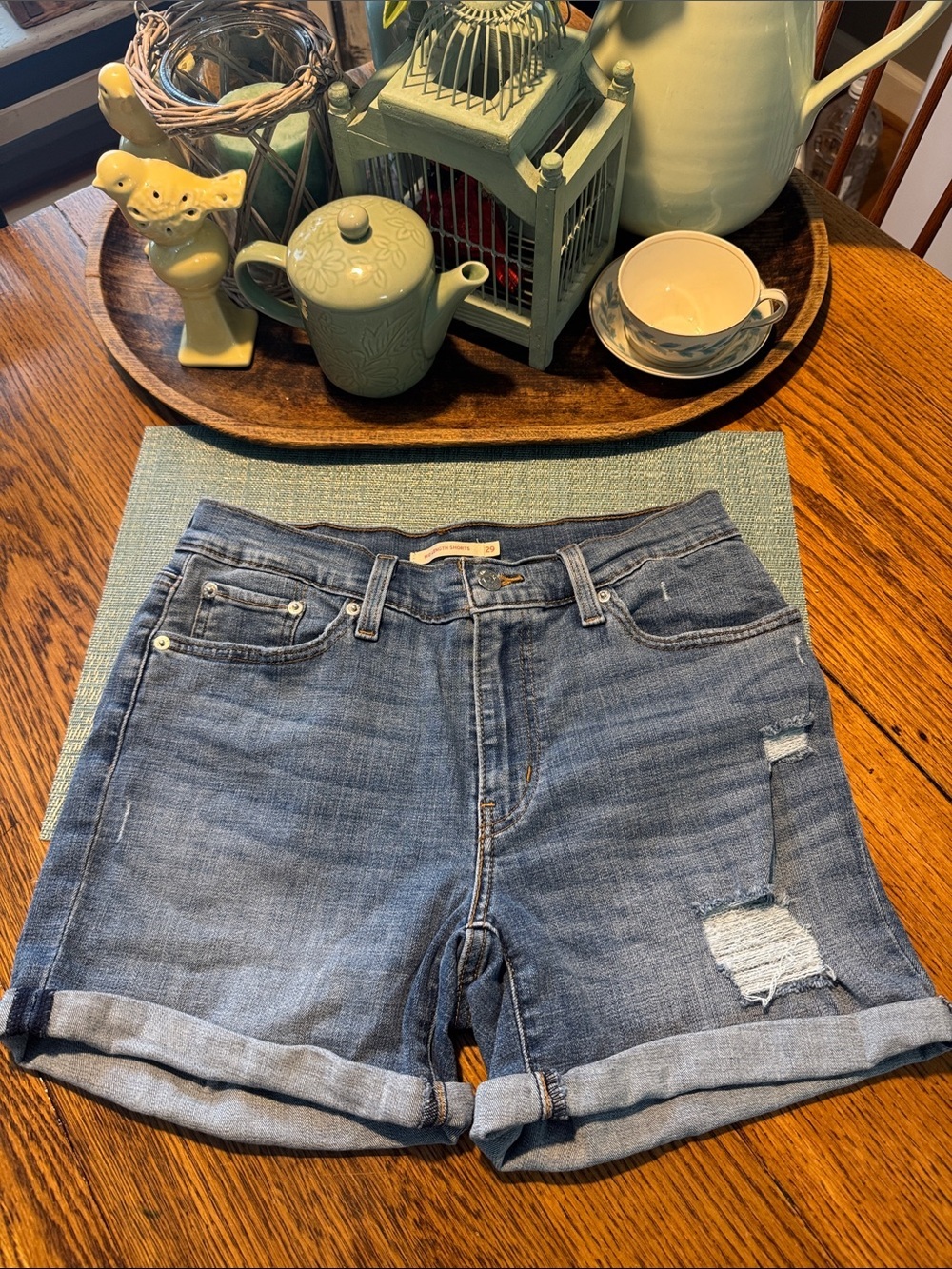 Levis Mid Length Medium Wash Distressed shorts - Women’s 29